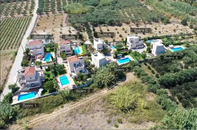 an aerial view of a villa with houses andyards at Selini Villas with private pool 10 minutes walking from the beach in Ropanianá