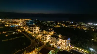 a view of a city at night with lights at Folia Apartments Chania in Agia Marina Nea Kydonias
