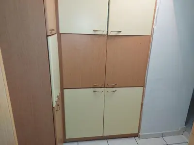 a closet with white cabinets and a mirror at Sonia cyclamen in Chania Town
