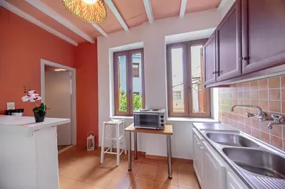 a kitchen with a sink and a microwave on a table at KasteliSuites in Chania Town