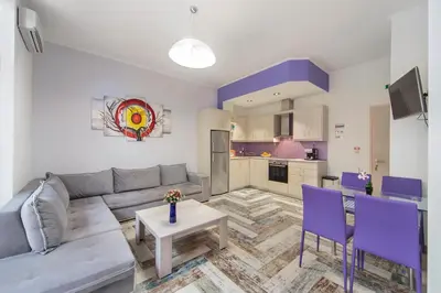 a living room with a couch and a table at KasteliSuites in Chania Town