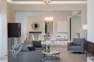 a living room with a couch and a table at Villa Pirgos Luxury in Kissamos