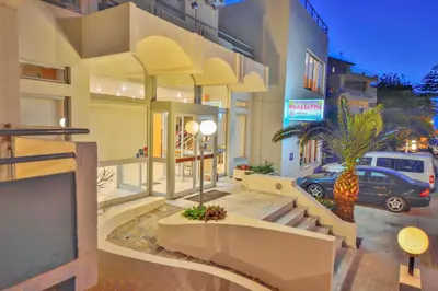 a building with a car parked in front of it at Falassarna Hotel in Chania Town