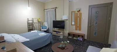 a hotel room with a bed and a tv at Casa.Costiera in Palaiochóra