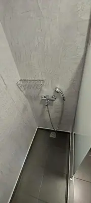a shower in the ceiling of a bathroom at Casa.Costiera in Palaiochóra