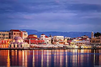 a group of buildings next to a body of water at Casa Maria 300 meters from the sea in Chania Town