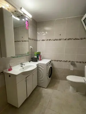 a bathroom with a washing machine and a washer at Claudia villa 2 in Agia Marina Nea Kydonias