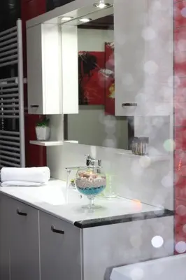 a bathroom with a sink with a bowl on a counter at Kallia's Modern Apartment in Kissamos