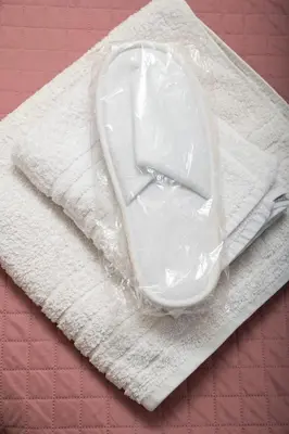 a white computer mouse in plastic on a napkin at Halepa Luxury Apartments in Chania Town