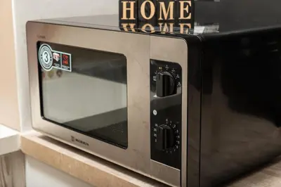 a microwave oven sitting on top of a counter at Halepa Luxury Apartments in Chania Town