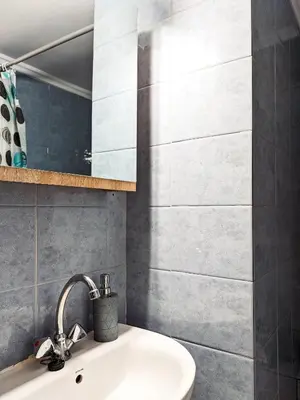a bathroom with a sink and a mirror at Beautiful apartment in Chania in Chania Town