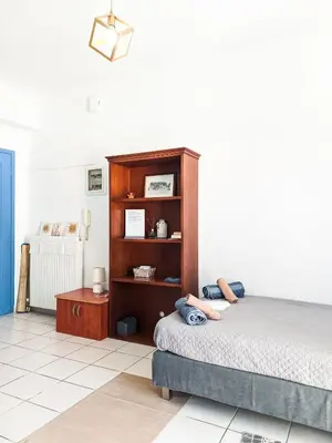 a bedroom with a bed and a book shelf at Beautiful apartment in Chania in Chania Town