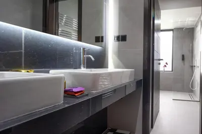 a bathroom with two sinks and a mirror at SeaSilia Luxury Villa in Korakiaí