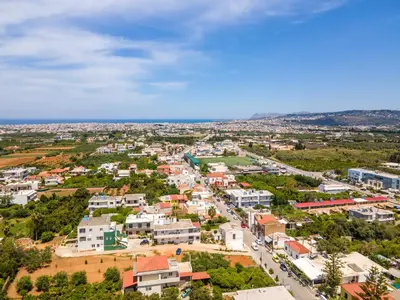 an aerial view of a small town with houses at Thelma and Louise house in Mourniaí