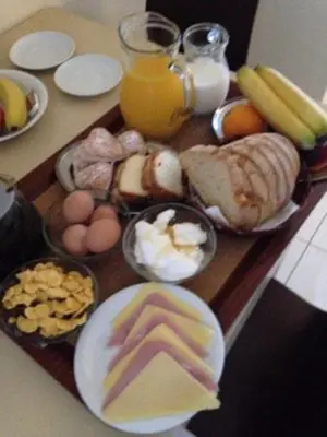 a tray of breakfast foods on a table at Theros Hotel in Tavronitis