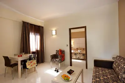 a living room with a couch and a table at Theros Hotel in Tavronitis