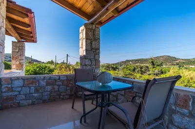 a table and chairs on a patio with a view at Villa Vicina - In Platanias and 4min by the beach in Chania Town