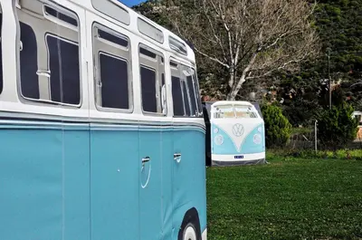 a blue and white bus parked in the grass at Cornelia Hippie Magic Bus in Kissamos