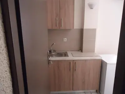 a small kitchen with a sink and a sink at ROMANTZA apartments in Agia Marina Nea Kydonias