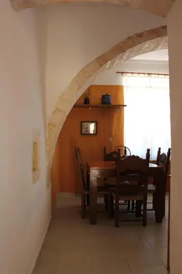 a dining room with a table and chairs at Evanthea Residence in Kounoupidhianá