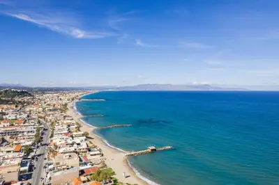 an aerial view of a beach and the ocean at Orama Luxury Apartments in Agia Marina Nea Kydonias