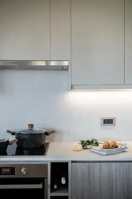 a kitchen with a stove and a pot and some food at Emmanuel's Sea View Luxury Apartment in Kissamos