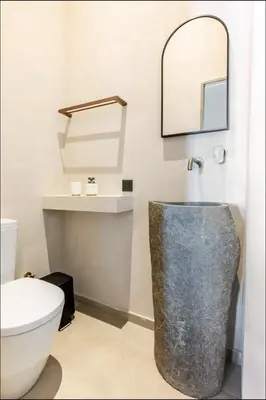 a bathroom with a toilet and a mirror at PETRA - casa casa group in Chania Town