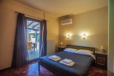 a bedroom with a bed with two towels on it at Villa Chloe - Amazing view Villa with swimming pool in Chania Town