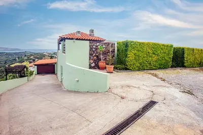 a small house on top of a hill at Villa Chloe - Amazing view Villa with swimming pool in Chania Town