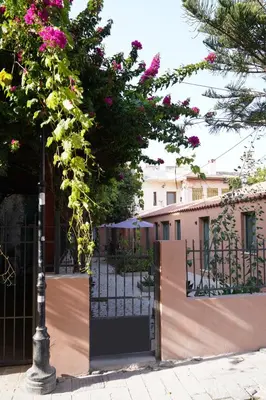a gate to a house with pink flowers on it at Lindas Convent Garden Home 1 in Chania Town