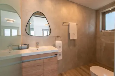 a bathroom with a sink and a mirror at Actea Seaview Villas I 