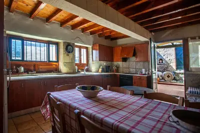 a kitchen with a table with a bowl on it at Villa Polirinia in Kissamos