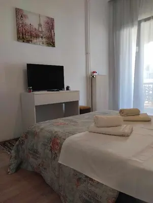 a bedroom with a bed with two towels on it at EMMY APARTMENT in Chania Town