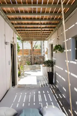 a porch with a pergola and a patio at Villa Olvía in Sfakiá