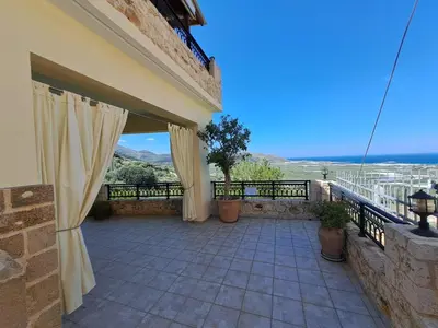 a balcony of a house with a view of the ocean at Falasarna's Sunset Home in Falasarna