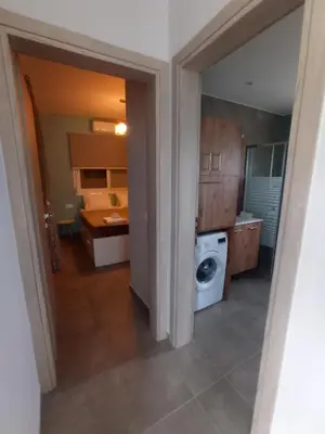 a kitchen with a washer and a washing machine at Nostalgico cottage in Chania Town