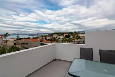 a balcony with a view of a city at Perla Dream Luxury Villa in Chania Town