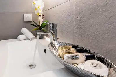 a bathroom sink with a chrome sink at Perla Dream Luxury Villa in Chania Town