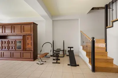 a room with a gym with several exercise equipment at Villa Rea Chania in Argoulidhés