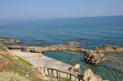 a group of people in a pool in the ocean at Mirma Halepa superior studio in Chania Town