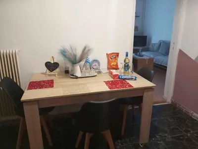 a wooden table with red items on top of it at Apartment - Sleeps 4 & Free Parking in Chania Town