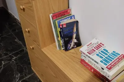 two books are sitting on a wooden shelf at Apartment - Sleeps 4 & Free Parking in Chania Town