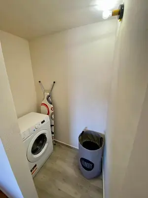 a laundry room with a washer and a washing machine at Georginas home in city center in Chania Town