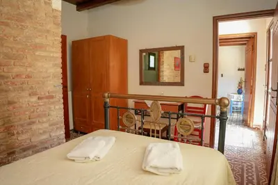 a bedroom with a bed with two towels on it at Traditional Villa with pool in Sfakia in Ímbros