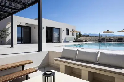 a villa with a swimming pool and a villa at Villa Kafkales Maleme - Heated Pool in Maleme