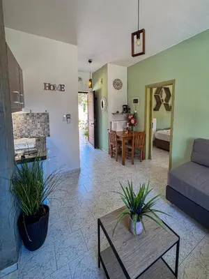 a living room with a couch and a table at Kydonia apartments in Plataniás