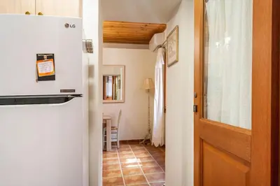 a room with a door and a hallway with a floor at Cozy house in the old town in Chania Town