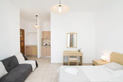 a living room with a couch and a table at Kristina Stelios Apartment in Plataniás