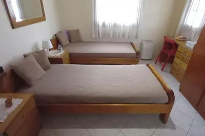 a living room with two beds and a couch at Giannis Traditional House in Vamos