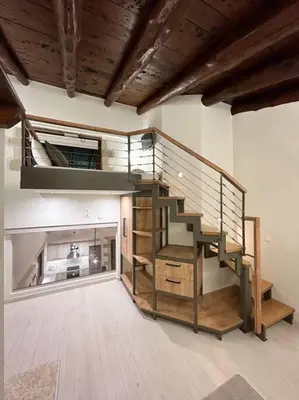 a large room with a staircase in the middle at Villa Recluso-3 bd luxury country villa, huge heated pool with hydromassage, individual bbq & large yard, mountain view in Maláxa